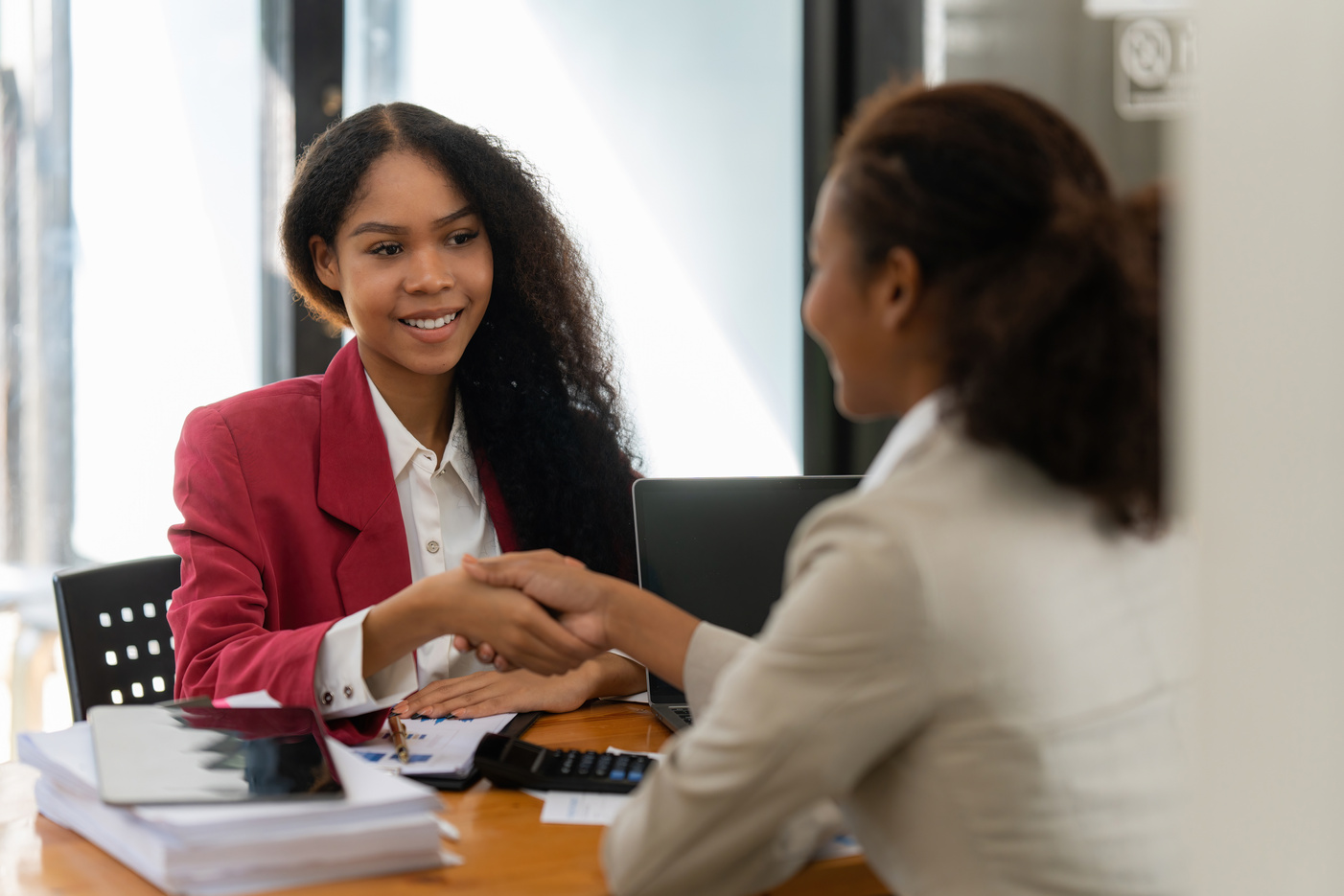 Two Businesswomen Shaking Hands